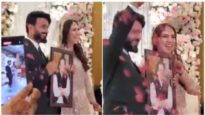 നീല കവറില്‍ പൊതിഞ്ഞ് വധുവിനായി സർപ്രൈസ് സമ്മാനവുമായി വരൻ; വേദിയില്‍ തന്നെ തുറന്ന് നോക്കി, വൈറലായി വീഡിയോ