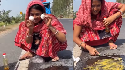 Social media users express disapproval as woman's video of cooking omelette on road goes viral [WATCH]
