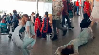 ಎದ್ದೂ ಬಿದ್ದೂ ನೆಲದಲ್ಲಿ ಹೊರಳಾಡ್ತಾಳೆ, ಏರ್ಪೋರ್ಟ್ನಲ್ಲಿ ಯುವತಿಯ ಡ್ಯಾನ್ಸ್; ಜನರು ಕಕ್ಕಾಬಿಕ್ಕಿ!