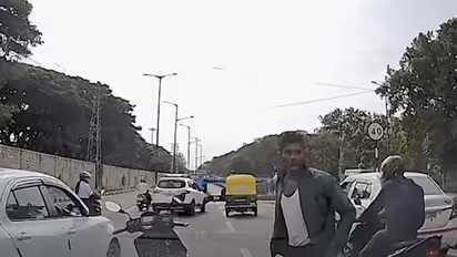 Caught on camera: Bengaluru biker smashes car windows with coconut shell (WATCH)