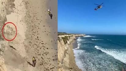 വിദൂരബീച്ചിൽ കുടുങ്ങി യുവാവ്, കല്ലുകളുപയോ​ഗിച്ച് മണലിലെഴുതി 'ഹെൽപ്', ഒടുവിൽ