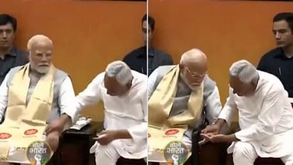 What is Nitish Kumar checking? Internet abuzz as Bihar CM checks PM Modi's hand in surprise move (WATCH)