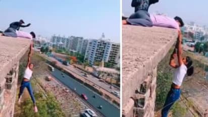 ರೀಲ್ಸ್ಗಾಗಿ ಹುಡುಗನ ಕೈ ಹಿಡಿದು ಕಟ್ಟಡದ ಅಂಚಿನಲ್ಲಿ ನೇತಾಡಿದ ಯುವತಿ