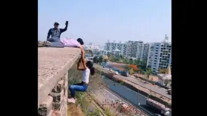 Viral Video Captures Girl Dangling from Edge of Building [WATCH]