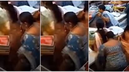 2 പേർ മറ തീർത്തു, പെട്ടികൾ വിദഗ്ധമായി സാരിക്കുള്ളിൽ ഒളിപ്പിച്ച് സ്ത്രീ; അത്ര പന്തിയല്ലാത്ത നടത്തം, ദൃശ്യങ്ങൾ