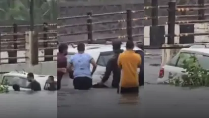 കനത്ത മഴയിൽ വെള്ളം പൊങ്ങിയതറിഞ്ഞില്ല, 20 അടിയോളം വെള്ളക്കെട്ടിലേക്ക് കാർ ഓടിച്ചിറക്കി; രക്ഷകരായി നാട്ടുകാർ