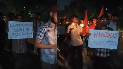 JNU students hold candlelight march in solidarity with Hindus in Bangladesh amid recent attack (WATCH)