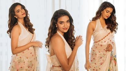 Viral Photos: Keerthy Suresh looks stunning in white saree with halter-neck blouse; fans don't miss it!