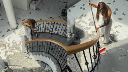 കാശിനോടല്പം ബഹുമാനമൊക്കെ വേണ്ടേ? നോട്ടുകൾ അടിച്ചുവാരിക്കൂട്ടുന്ന യുവതി, വീഡിയോ