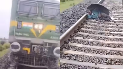 തണലിന് കുട, റെയിൽവേ ട്രാക്കിൽ കിടന്നുറങ്ങുന്ന മനുഷ്യൻ, ട്രെയിൻ നിർത്തി പുറത്തിറങ്ങി ലോക്കോ പൈലറ്റ് 