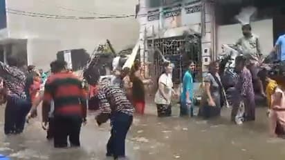 Gujarat's flooded streets turn dance floor as locals perform Garba in knee-deep water (Watch)