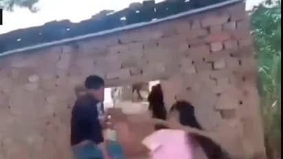 Bihar girl thrashes boy with stick for passing lewd comments at her; onlookers record act (WATCH)