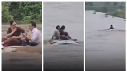 കുത്തിയൊഴുകുന്ന നദിയിൽ മുങ്ങിയ കാറിന്‍റെ മുകളില്‍ ഇരിക്കുന്ന ദമ്പതികൾ: വീഡിയോ കണ്ട് അമ്പരന്ന് സോഷ്യൽ മീഡിയ