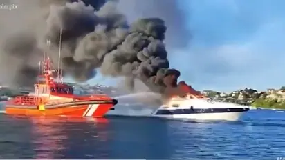 Dramatic rescue of 4 Britons as luxury yacht explodes in flames before sinking off Menorca island (WATCH)