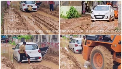 എന്തൊരു കഷ്ടം! ചെളിയിൽ പുതഞ്ഞ കാറിൽ 2 മണിക്കൂർ കുടുങ്ങി സ്ത്രീയും കുട്ടികളും, കാർ ഉയർത്തിയത് ക്രെയിനെത്തിച്ച്