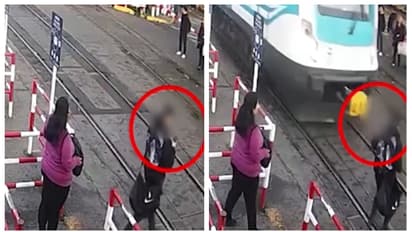 ഞെട്ടിക്കുന്ന ദൃശ്യങ്ങൾ; ഫോണിൽ സംസാരിച്ച് റെയില്‍വേ ട്രാക്ക് മുറിച്ച് കടക്കവെ തലനാരിഴയ്ക്ക് ഒരു രക്ഷപ്പെടല്‍ 