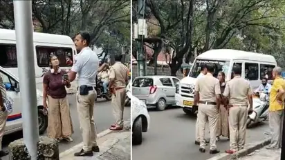 Bengaluru SHOCKER: Enraged woman hurls abuses to traffic policeman in Hindi, stamps cop's foot (WATCH)