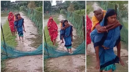 ദാന ചുഴലിക്കാറ്റ്; വൃദ്ധയെ ചുമന്ന് സുരക്ഷിത കേന്ദ്രത്തിലേക്ക് മാറ്റുന്ന ആശാവര്‍ക്കരെ അഭിനന്ദിച്ച് സോഷ്യൽ മീഡിയ