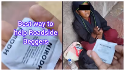 കൈക്കുഞ്ഞുമായി ഭിക്ഷാടനം നടത്തുന്ന യുവതിക്ക് കോണ്ടം സമ്മാനിച്ച് യുവാവ്; പിന്നാലെ രൂക്ഷ വിമര്ശനം