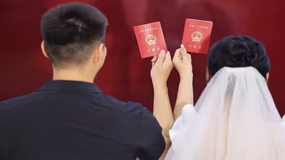 China's marriage registrations dip by almost a million in 2024 amid rising living costs & economic uncertainty