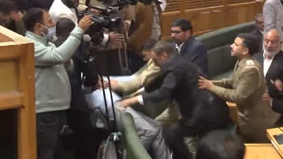 J&K Assembly erupts with protests again: MLAs exchange blows over Article 370 resolution (WATCH)