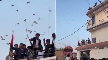 Rs 100, Rs 500 notes in air! UP family showers Rs 20 lakh cash at wedding procession; video goes viral (WATCH)