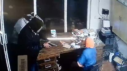 Filmy-style heist on camera: 2 masked men barge into petrol pump, loot Rs 4 lakh cash at gunpoint in UP| WATCH