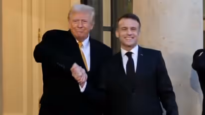 Viral video: Donald Trump greets Macron with intense 17-second handshake ahead of Notre Dame event (WATCH)