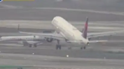 Disaster averted as plane stops just in time to avoid crash with private jet at Los Angeles airport (WATCH)