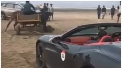 വിലക്ക് വകവെയ്ക്കാതെ ഫെറാരി ബീച്ചിലിറക്കി, കുടുങ്ങി; ഒടുവിൽ രക്ഷപ്പെടുത്താൻ നാട്ടുകാർ കൊണ്ടുവന്നത് കാളവണ്ടി