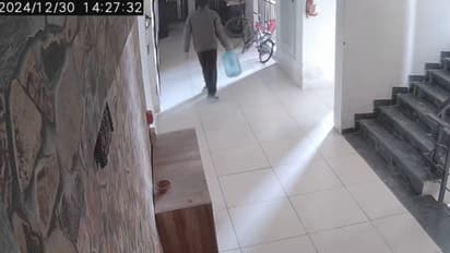 Caught on camera: Water delivery boy steals footwear kept outside flat in Greater Noida society (WATCH)