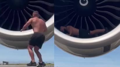 വീഡിയോ കണ്ടവർ ഒന്നടങ്കം ചോദിക്കുന്നു 'ബട്ട് വൈ'? വിമാനത്തിന്‍റെ എഞ്ചിന് സമീപം  യുവാവിന്റെ പുഷ്-അപ്പ് 