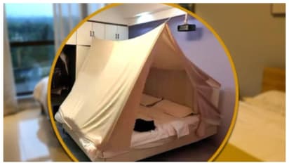 രഹസ്യ കാമറ;  ഹോട്ടല്‍ റൂമില്‍ ടെന്‍റ് കെട്ടി ചൈനീസ് യുവതി, ബുദ്ധിമതിയെന്ന് സോഷ്യൽ മീഡിയ 