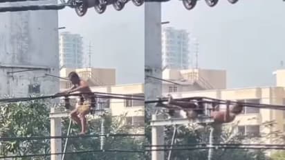 എന്താണ് ബ്രോ, ജീവിതം ഒന്നല്ലേയുള്ളൂ; പവർ കേബിളിൽ യുവാവിന്റെ പുൾ അപ്പ്, വൈറലായി വീഡിയോ