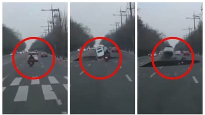 ഹൃദയം നിലച്ച് പോകുന്ന കാഴ്ച; റോഡിലൂടെ പോകവെ പെട്ടെന്നുണ്ടായ ഭീമൻ കുഴിയിലേക്ക് തലകുത്തി വീണ് ബൈക്ക് യാത്രക്കാരൻ