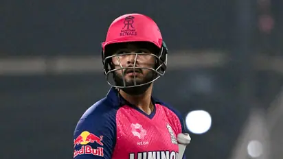 IPL 2025, RR vs KKR: Fan invades pitch and touches Riyan Parag's feet during the match in Guwahati (WATCH)