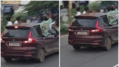 കെഎൽ 09 എഎസ് 0460 കാർ, വിൻഡോയിലൂടെ കൈയും തലയുമടക്കം പുറത്തിട്ട് ആടിപ്പാടി സർവീസ് റോഡിലൂടെ യുവാക്കളുടെ യാത്ര