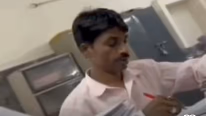 Madhya Pradesh peon checks university papers in professor's absence, gets Rs 5,000, video goes viral (WATCH)