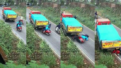 ആയുസിന്‍റെ ബലം! കയറ്റത്തിൽ ലോറി പിന്നോട്ട് നീങ്ങി, സ്കൂട്ടർ യാത്രക്കാരി അത്ഭുതകരമായി രക്ഷപ്പെട്ടു