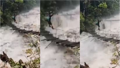 ആർത്തലക്കുന്ന പുഴ, ആടിയുലയുന്ന തൂക്കുപാലം, കയറിൽ തൂങ്ങി യുവാവിന്റെ സാഹസികത- വീഡിയോ