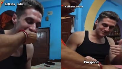 विदेशी युवक को हाथ से खाना खिलाती कोलकाता की एक मां