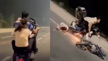 bike stunt couple crash viral video safety warning