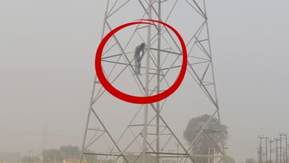 varanasi lover climbs 11000 volt high tension tower