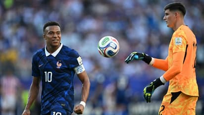 France Captain Kylian Mbappe and Paraguay Goalkeeper Orlando Gill