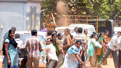 Who instigated the factory workers' agitation in Bengaluru?