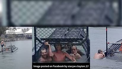 Idiotic trio think its bravery to click photos in a crocodile trap
