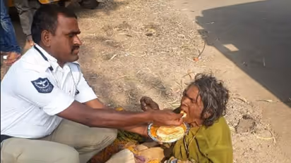 Kind Hyderabad traffic cop's picture feeding a homeless woman goes viral