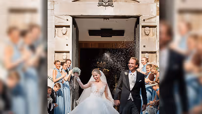 The heir to Swarovski crystals got married and the weight of her wedding gown will shock you