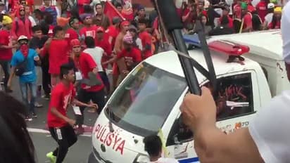 Video: Police van runs over woman in Philippines during protest