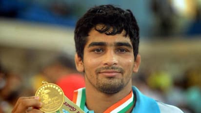 ಚಿನ್ನ ಗೆದ್ದ ತೋಮರ್, ಪೋಗಟ್